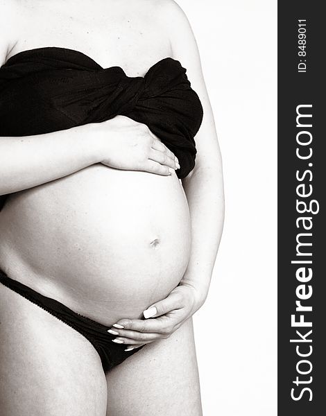 The photo of a pregnant woman in black and white