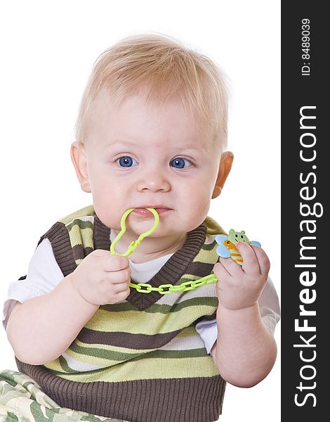 Little boy in a green vest on white background