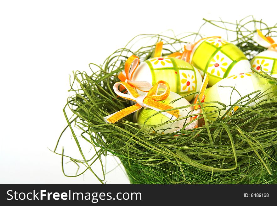 Easter eggs in basket isolated on white