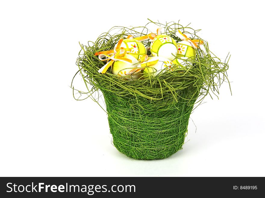 Easter eggs in basket isolated on white