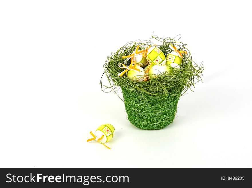 Easter eggs in basket isolated on white