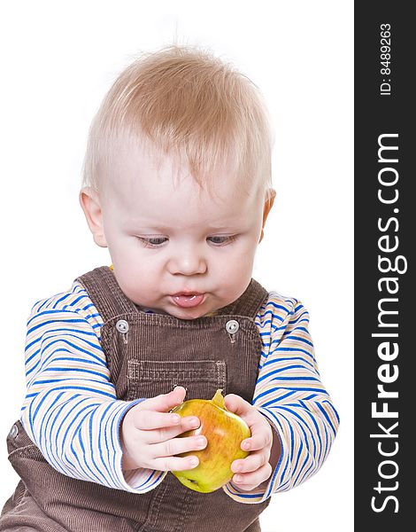 Little boy with big apple on white background