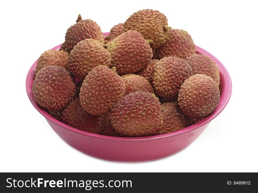 Fresh litchis in a bowl - isolated on white background. Fresh litchis in a bowl - isolated on white background