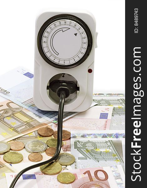 24 hours mechanical timer with Euro coins and bills over white background