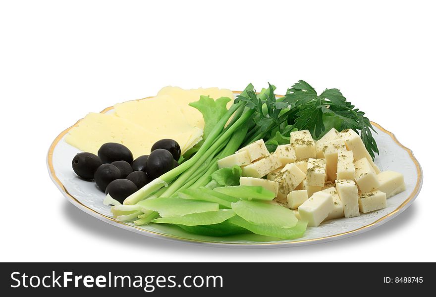 Plate with cheese and greens isolated on white background