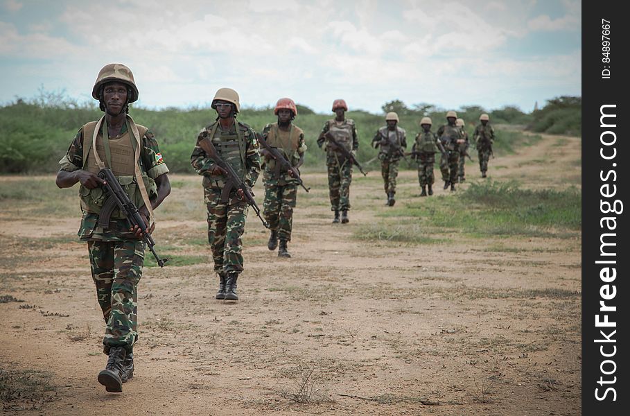 Burundian troops serving with the African Union Mission in Somalia &#x28;AMISOM&#x29; patrol near the village of Modmoday approx. 40km east of the central Somali town of Baidoa. The Burundians, together with forces of the Somali National Army &#x28;SNA&#x29; have been mounting &#x27;snap&#x27; foot patrols in villages and areas to the east of Baidoa where Al Qaeda-affiliated extremist group Al Shabaab mount attacks against local herdsmen, villages and travelers along the busy Baidoa-Mogadishu road. The AMISOM troops also use the patrols as an opportunity to provide occasional free medical treatment and fresh, potable drinking water for residents in the area. AU/UN IST PHOTO / ABDI DAKAN. Burundian troops serving with the African Union Mission in Somalia &#x28;AMISOM&#x29; patrol near the village of Modmoday approx. 40km east of the central Somali town of Baidoa. The Burundians, together with forces of the Somali National Army &#x28;SNA&#x29; have been mounting &#x27;snap&#x27; foot patrols in villages and areas to the east of Baidoa where Al Qaeda-affiliated extremist group Al Shabaab mount attacks against local herdsmen, villages and travelers along the busy Baidoa-Mogadishu road. The AMISOM troops also use the patrols as an opportunity to provide occasional free medical treatment and fresh, potable drinking water for residents in the area. AU/UN IST PHOTO / ABDI DAKAN.