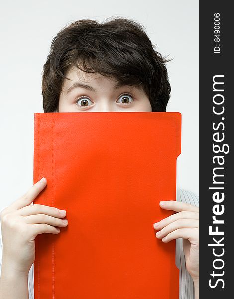 Amazed woman with red file