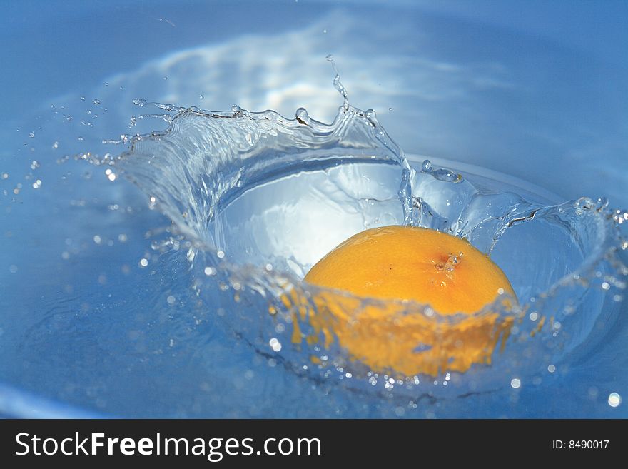 Nice background with lemon in blue splashing water. Nice background with lemon in blue splashing water