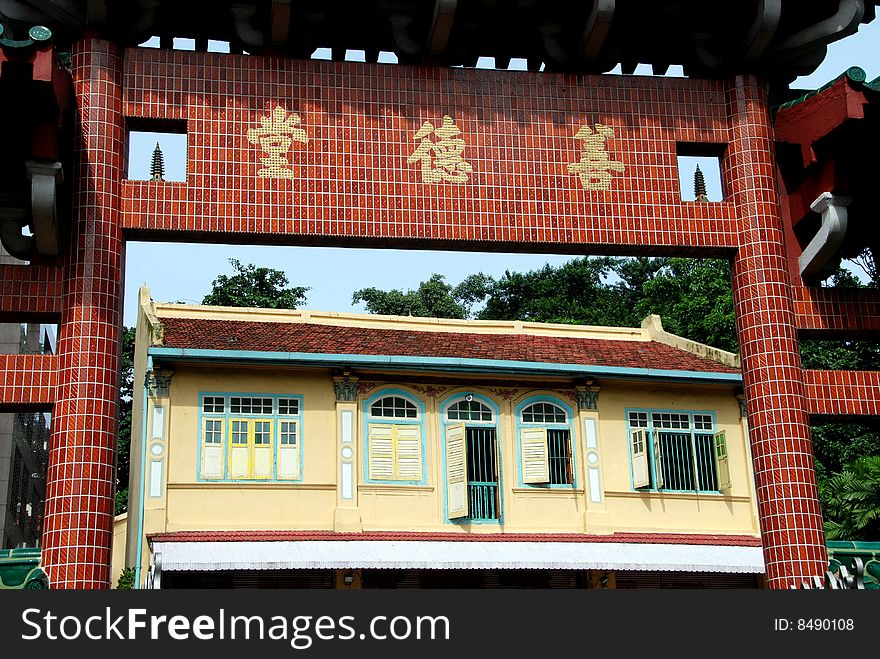 View through the entry gate to the small colonial style Shan De Tang Chinese Temple on Cavenagh Road
in Singapore - Lee Snider Photo. View through the entry gate to the small colonial style Shan De Tang Chinese Temple on Cavenagh Road
in Singapore - Lee Snider Photo.