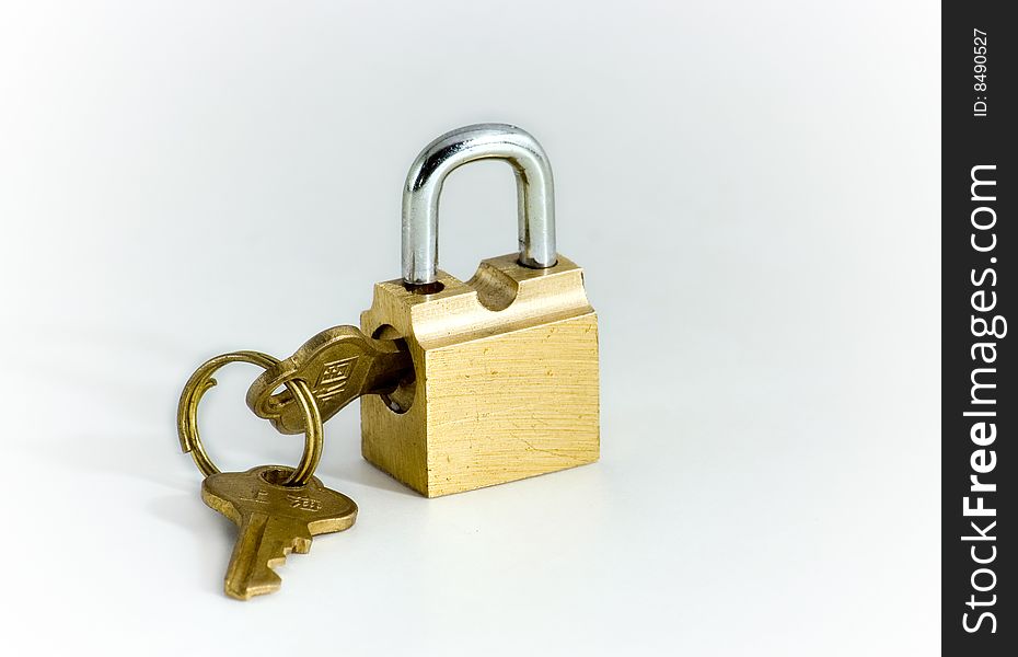 Key and lock of the wanted colour on white background