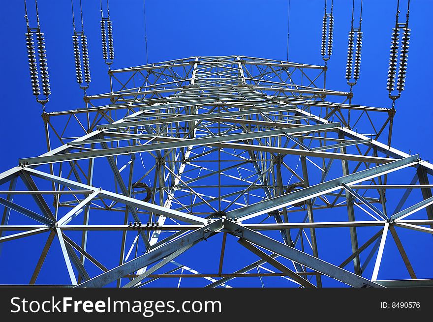 High voltage electricity pole under sky