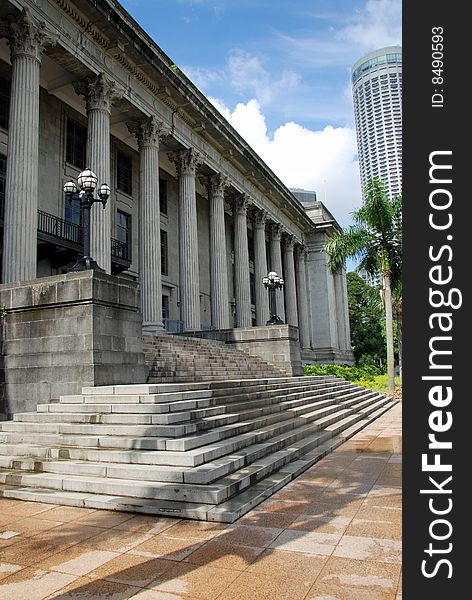 The imposing entrance front of 1926 Old City Hall with its row of massive Corinthian columns stands opposite the Padang in the historic colonial district of Singapore - Lee Snider Photo. The imposing entrance front of 1926 Old City Hall with its row of massive Corinthian columns stands opposite the Padang in the historic colonial district of Singapore - Lee Snider Photo.