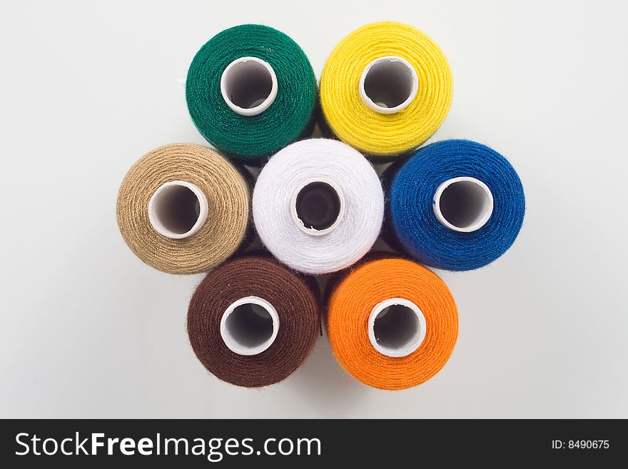 Colored sewing spools in hexagon shape