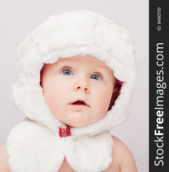 Small cute child in white hat