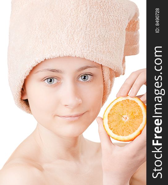 Pretty young girl with a an orange on white background. Pretty young girl with a an orange on white background