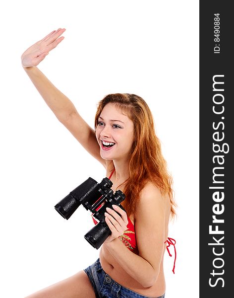 Young beautiful  girl in swimsuit on white background with binoculars.