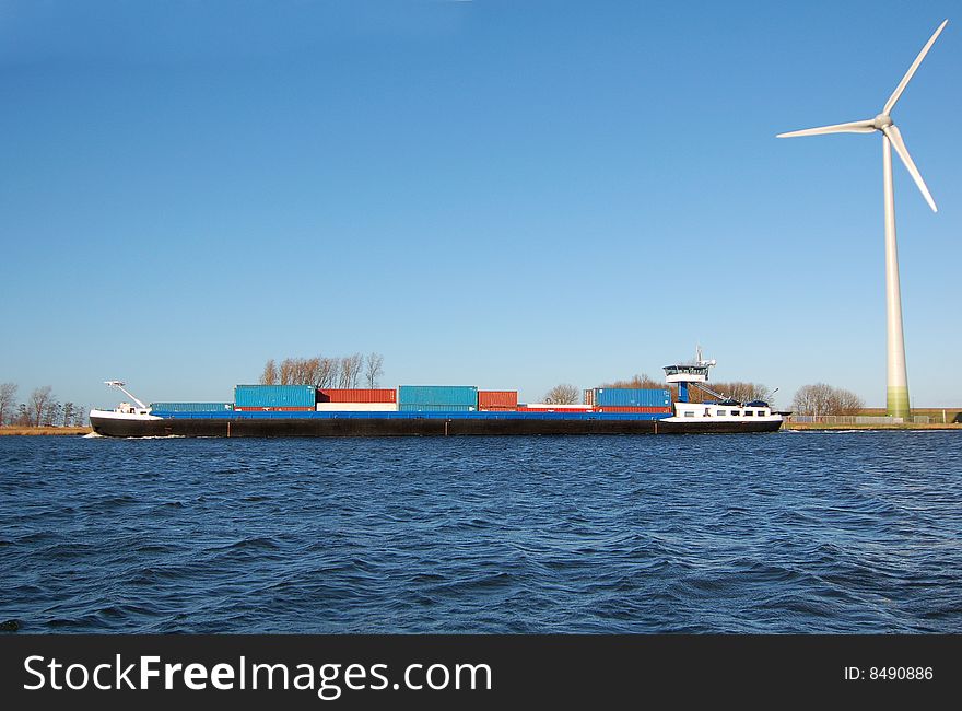 A container ship on North sea canal, Netherlands. A container ship on North sea canal, Netherlands