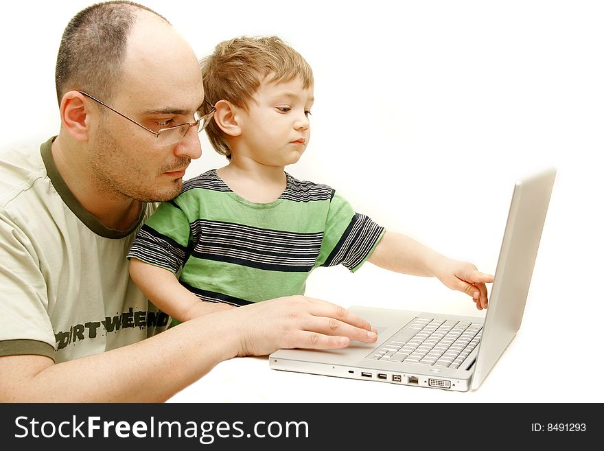 Father and son with laptop over white