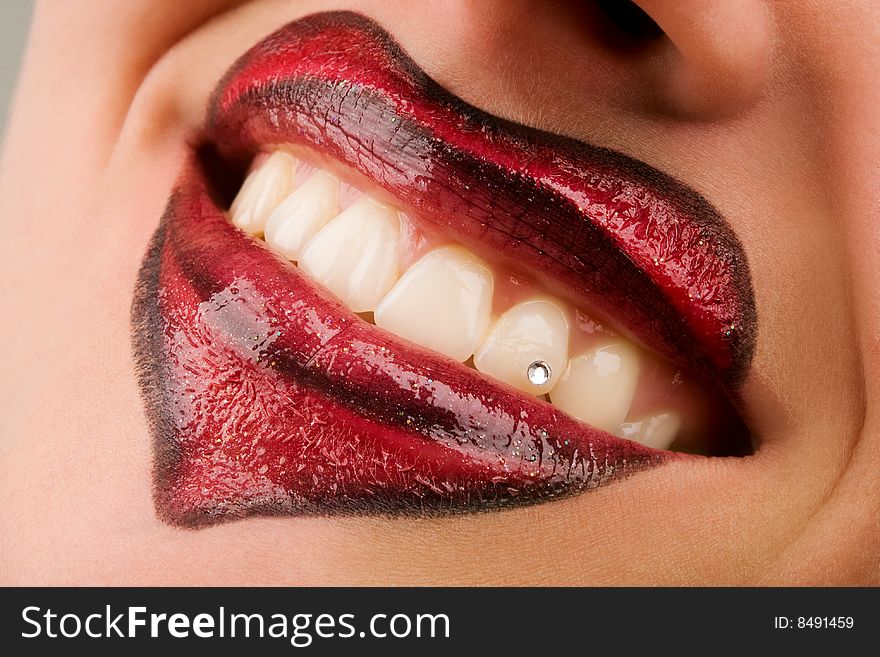 Closeup of women's lips with heart shaped lips makeup