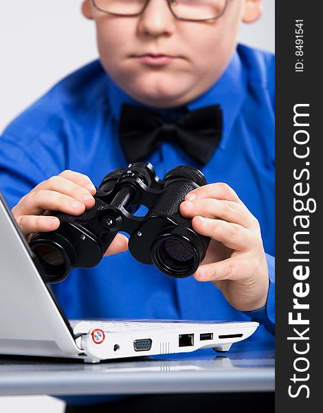 Boy Looking At Computer Screen In Binoculars