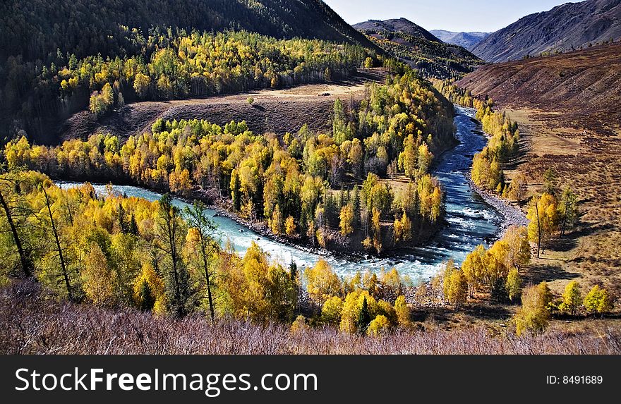A picturesque view of a river in the mountainous landscape in xinjiang,china.