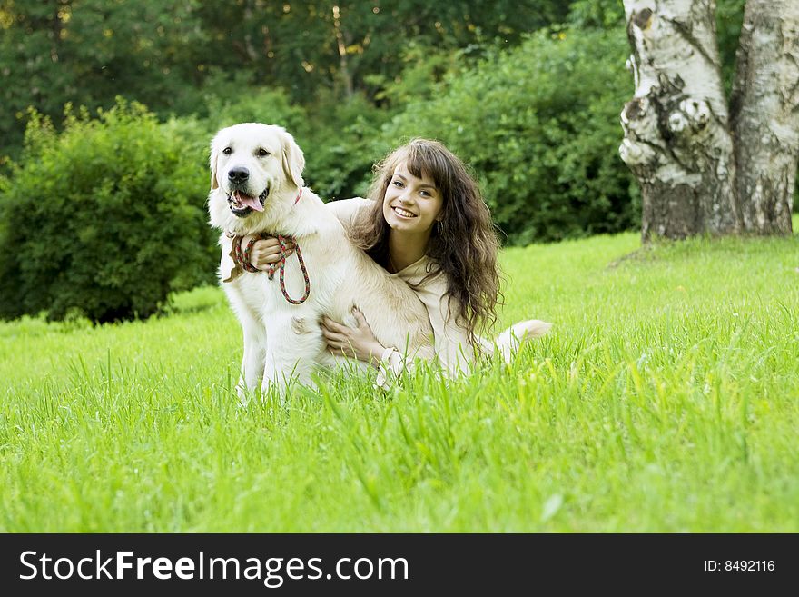 Picture of the girl with the golden retriever walk in the park. Picture of the girl with the golden retriever walk in the park