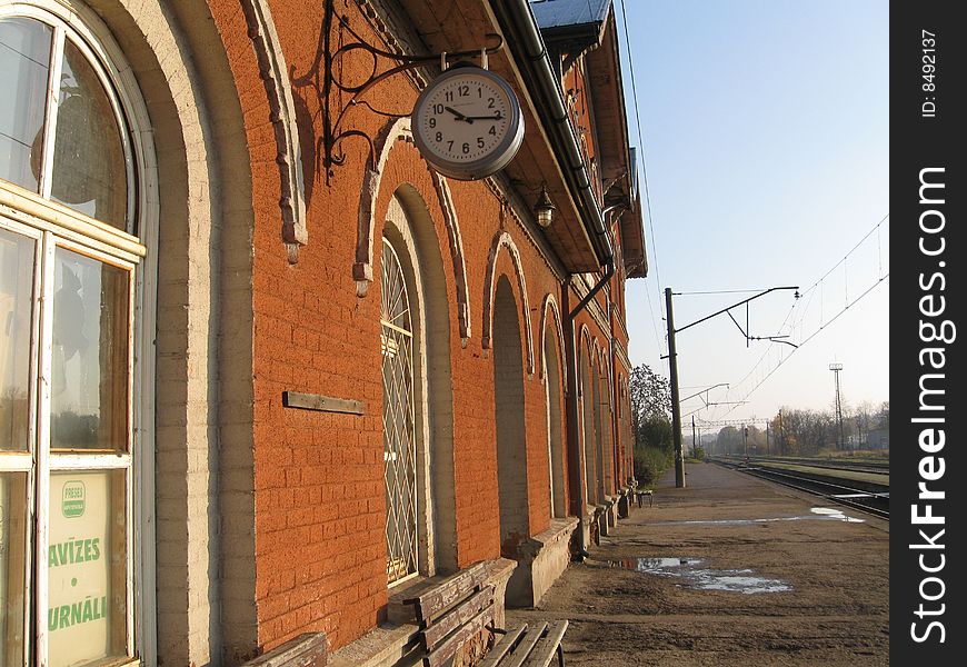 Railway station with clock. Fifteen past ten