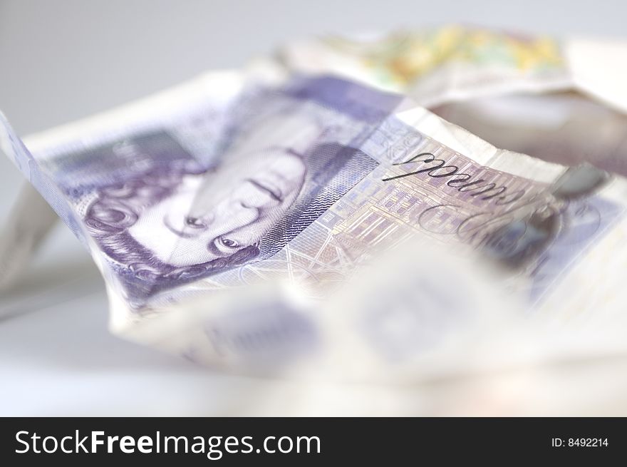 Studio shot of twenty pound banknote. photographed with selective focus (exacted on the eyes of Queen Elizabeth). Horizontal composition. Studio shot of twenty pound banknote. photographed with selective focus (exacted on the eyes of Queen Elizabeth). Horizontal composition.