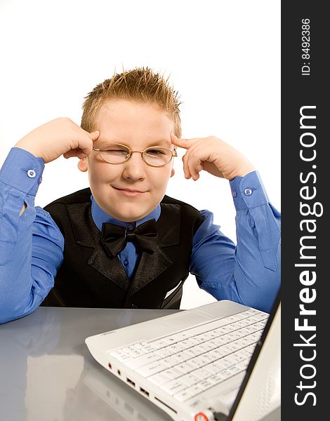 Funny school boy with laptop isolated over white