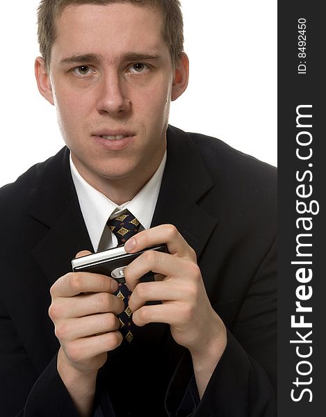 Elegant young man plays on mobile device. Elegant young man plays on mobile device