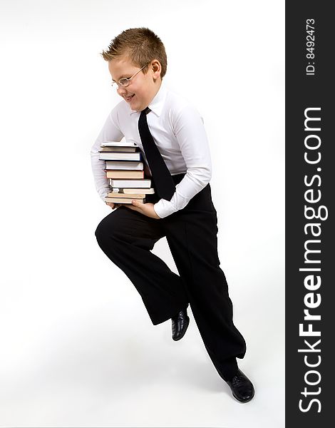 Funny boy running with books isolated on white. Funny boy running with books isolated on white