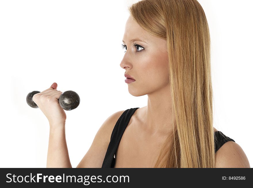 Blond beautiful woman lifting a weight