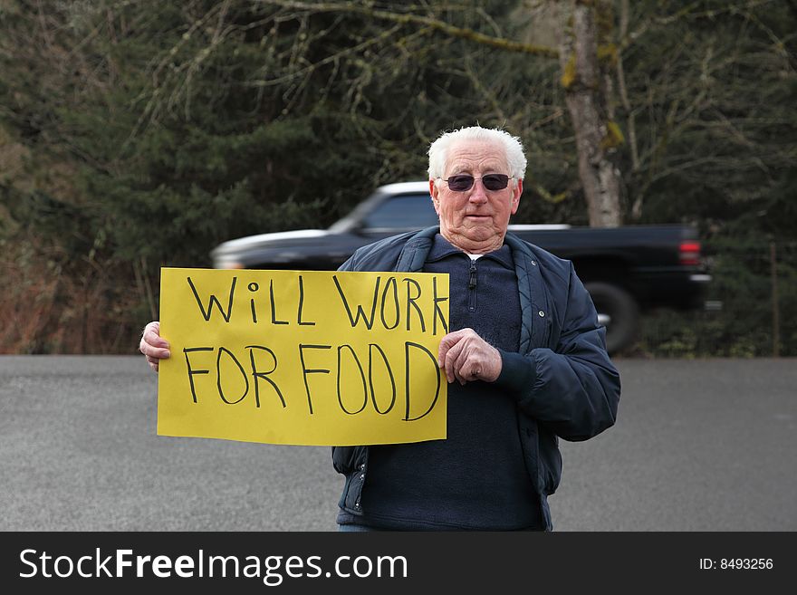 Older Senior Man With Sign For Work