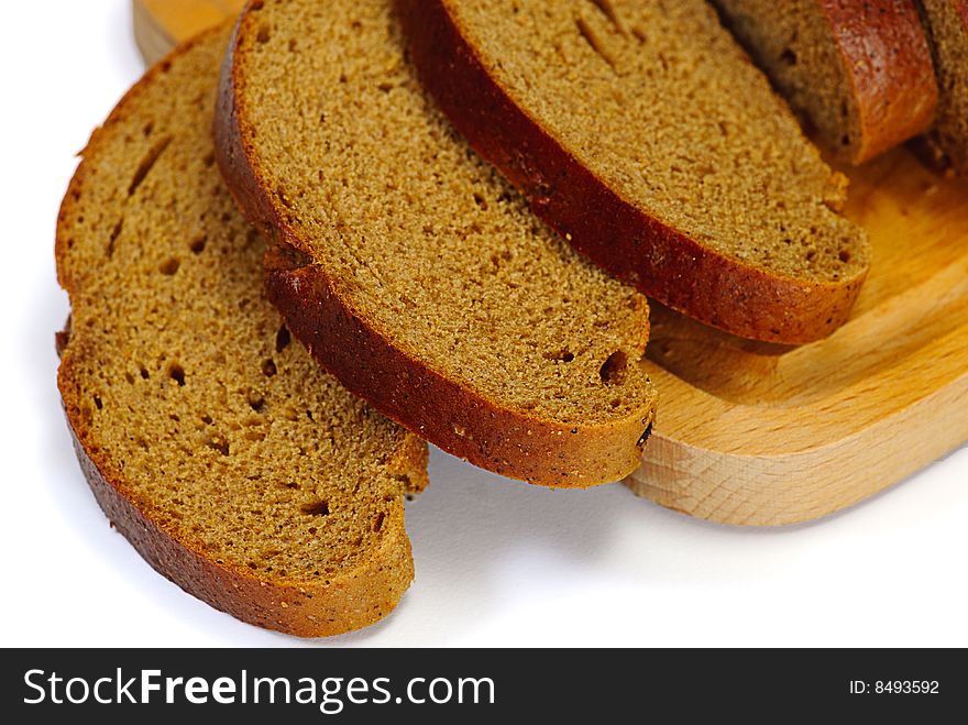 Brown bread on wooden plate