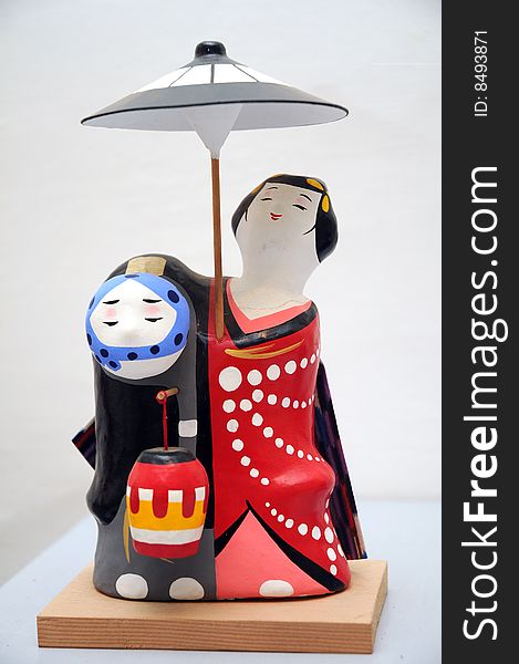 Traditional Japanese dolls on white background