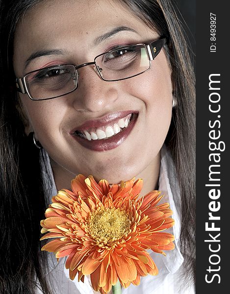 Girl with flower in studio.