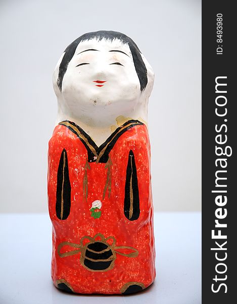 Traditional Japanese doll on white background