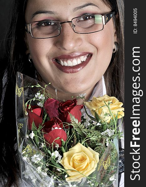 Girl holding colored roses in studio. Girl holding colored roses in studio