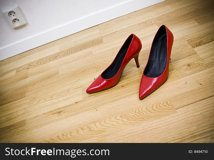 Fashionable female shoes on wooden floor. Fashionable female shoes on wooden floor