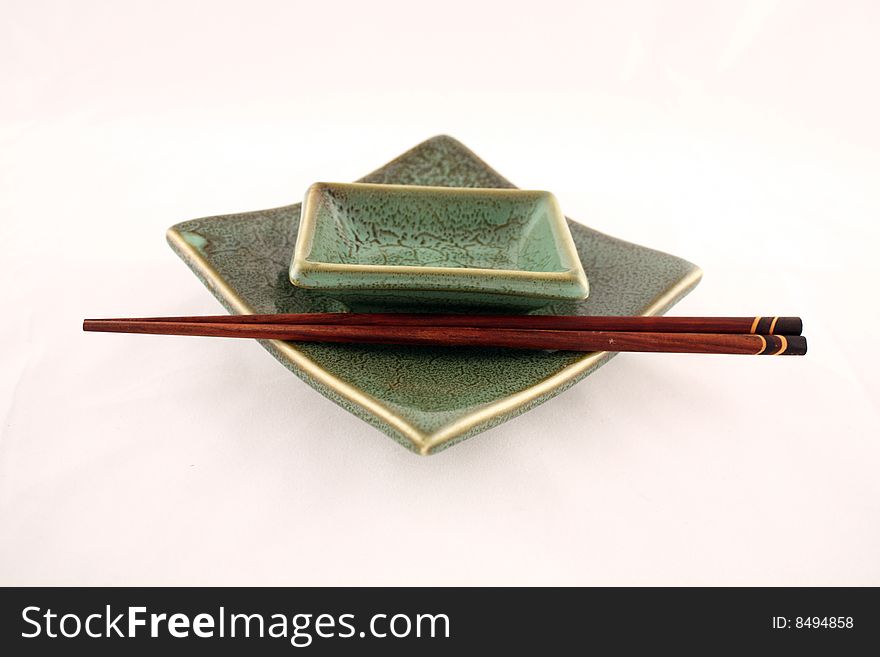 Green sushi plate isolated on white background