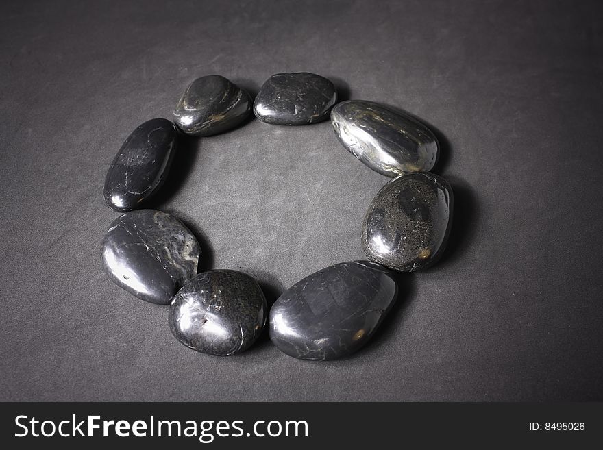 Zen stones on a gray background.