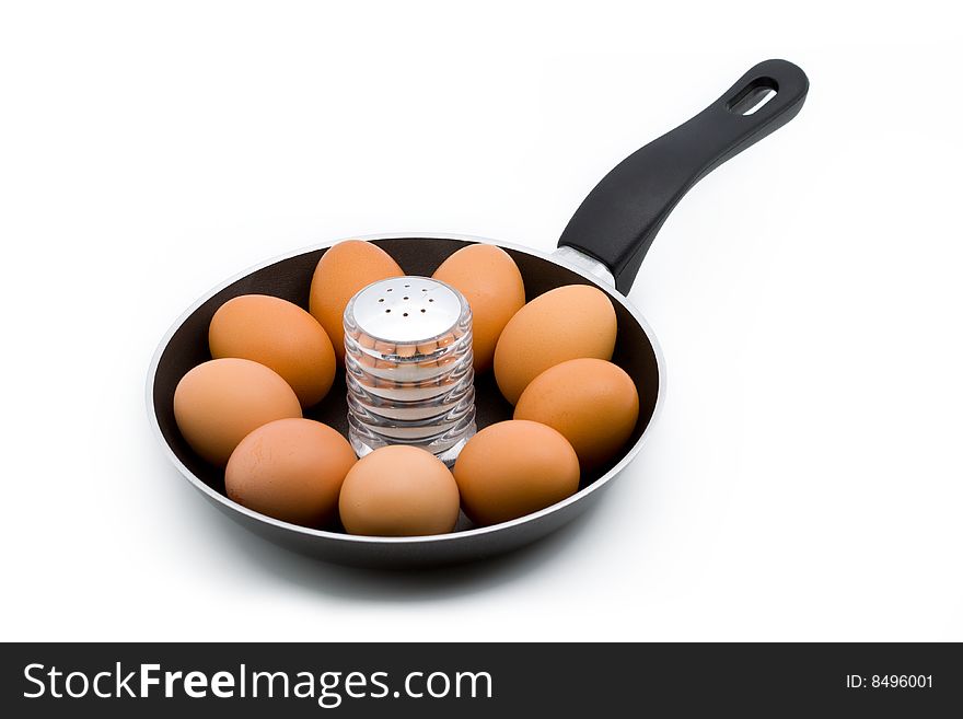 Whole Raw Eggs In A Pan With A Salt Can