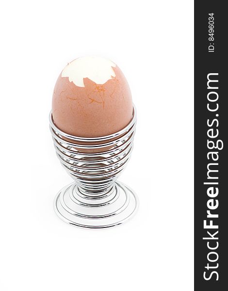 An Eggcup With A Pealed Egg