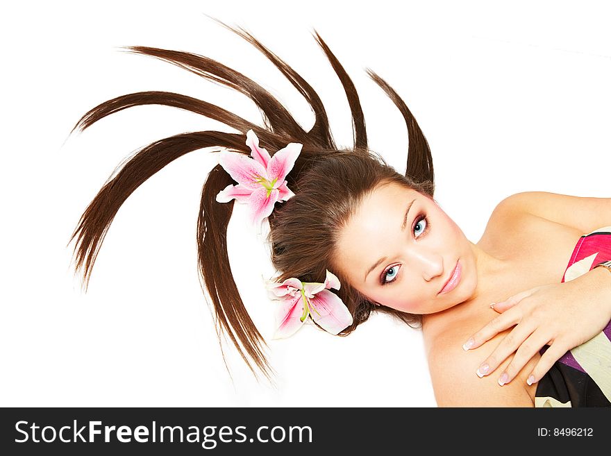 Beautiful young woman with flowers in her hair. Beautiful young woman with flowers in her hair