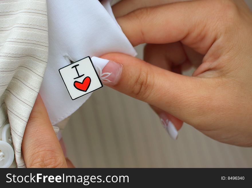 Wedding Cufflink Detail with human hands