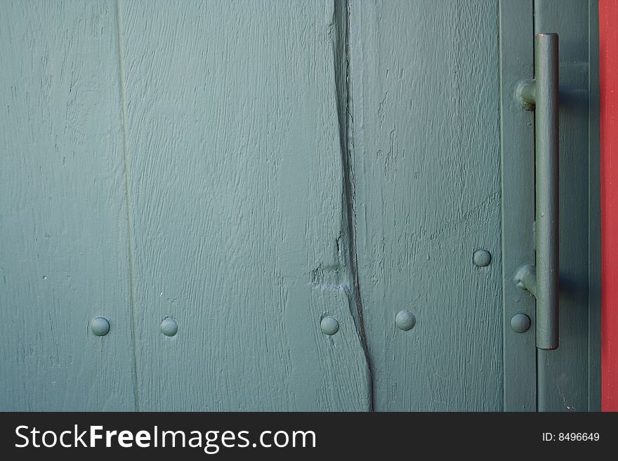 Textured green wood door