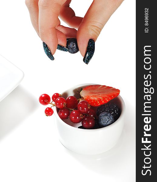 Fresh Berries Bowl and Beauty Woman Hand. Isolated on White Background