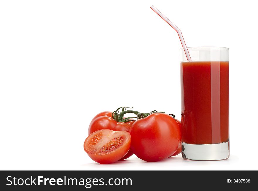Ripe juicy tomatoes and glass of tomato juice. Ripe juicy tomatoes and glass of tomato juice