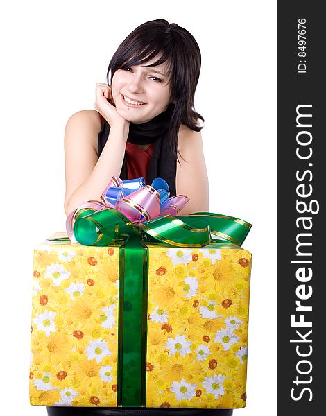 The young beautiful girl with a gift box on a color background. The young beautiful girl with a gift box on a color background