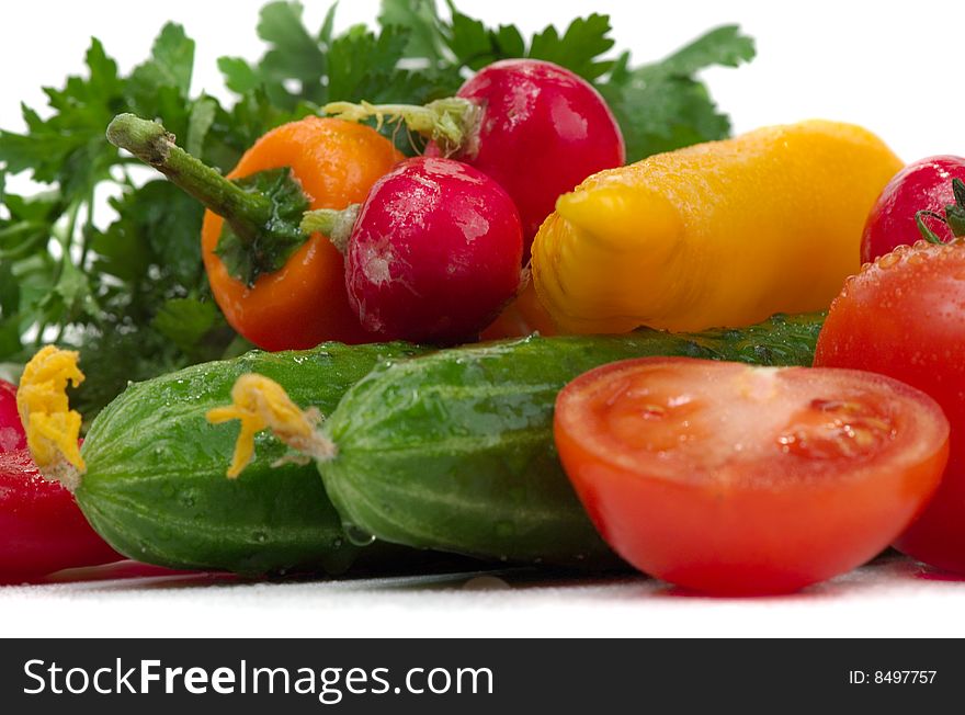 Many fresh juicy vegetables on a white background. Many fresh juicy vegetables on a white background